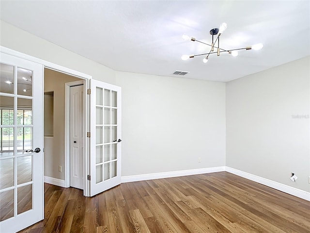 30 Lake Diamond Ave, Ocala, FL 34472 - empty room with a chandelier, baseboards, and wood finished floors