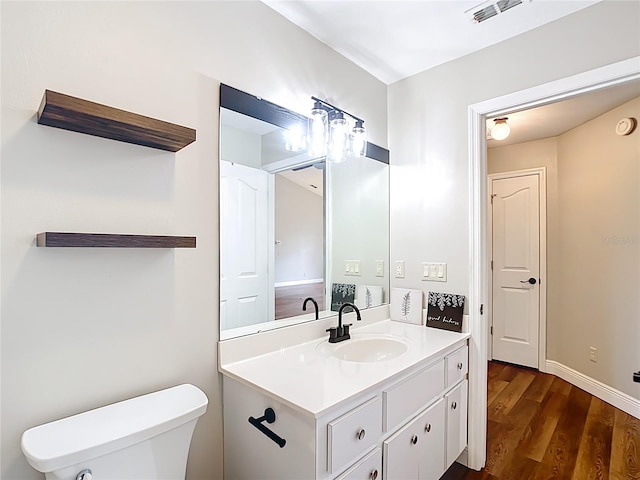 30 Lake Diamond Ave, Ocala, FL 34472 - bathroom with vanity, wood finished floors, toilet, and baseboards