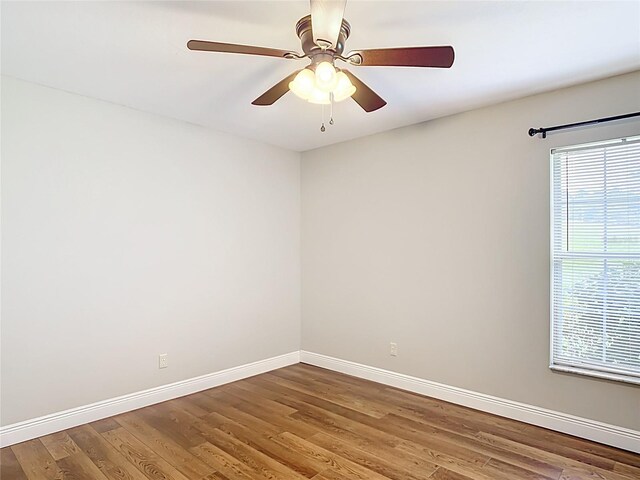 30 Lake Diamond Ave, Ocala, FL 34472 - unfurnished room with baseboards, wood finished floors, and ceiling fan