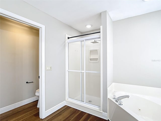 30 Lake Diamond Ave, Ocala, FL 34472 - full bath featuring a shower stall, wood finished floors, a whirlpool tub, toilet, and baseboards