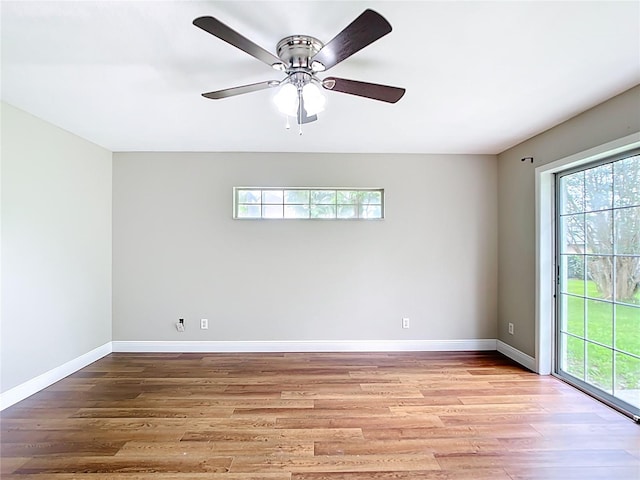 30 Lake Diamond Ave, Ocala, FL 34472 - unfurnished room featuring baseboards, light wood finished floors, and a ceiling fan