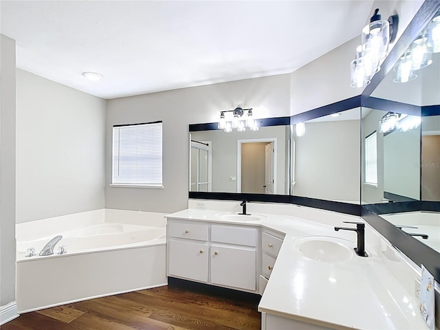 30 Lake Diamond Ave, Ocala, FL 34472 - full bath featuring a bath, wood finished floors, double vanity, and healthy amount of natural light