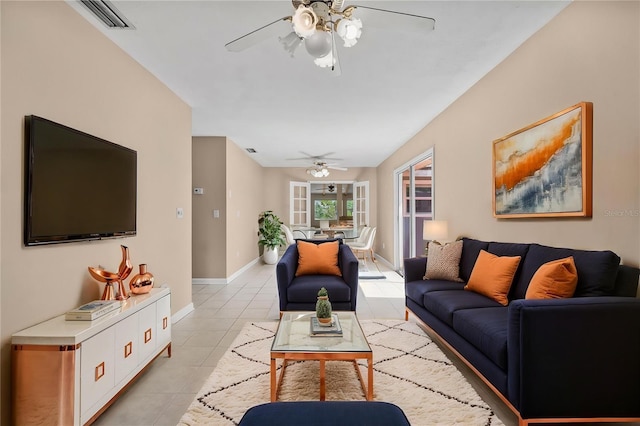 710 Carlton Ave, Lake Wales, FL 33853 - living room with a ceiling fan, light tile patterned floors, and baseboards
