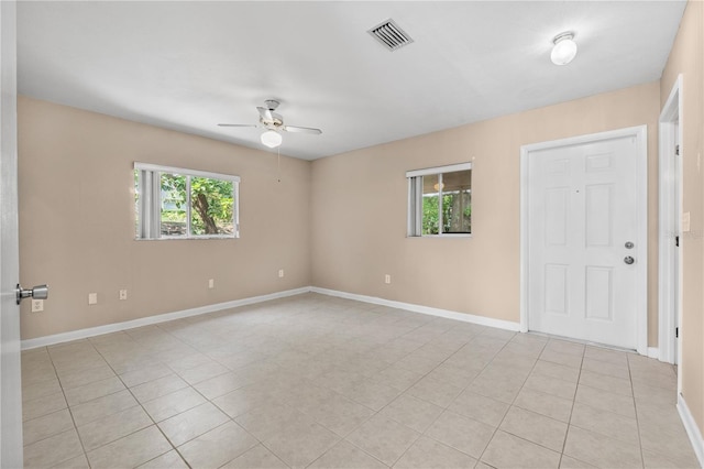 710 Carlton Ave, Lake Wales, FL 33853 - empty room featuring healthy amount of natural light, ceiling fan, and light tile patterned flooring