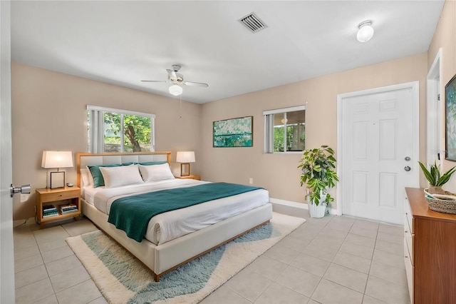 710 Carlton Ave, Lake Wales, FL 33853 - bedroom with light tile patterned floors, multiple windows, baseboards, and a ceiling fan