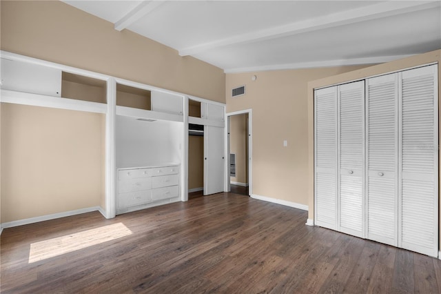 710 Carlton Ave, Lake Wales, FL 33853 - unfurnished bedroom with multiple closets, dark wood finished floors, and baseboards