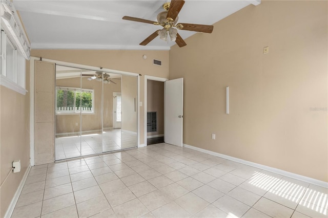 710 Carlton Ave, Lake Wales, FL 33853 - spare room with vaulted ceiling, ceiling fan, light tile patterned floors, and baseboards