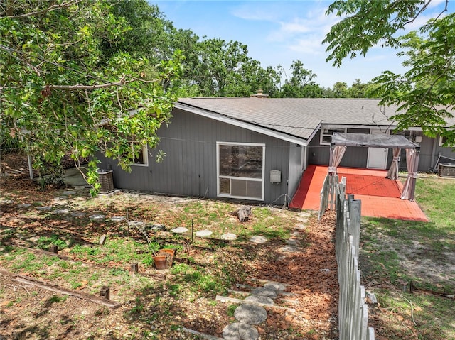 710 Carlton Ave, Lake Wales, FL 33853 - back of house with a wooden deck and a shingled roof