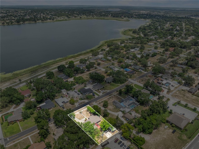 710 Carlton Ave, Lake Wales, FL 33853 - aerial perspective of suburban area with a large body of water and property boundaries highlighted