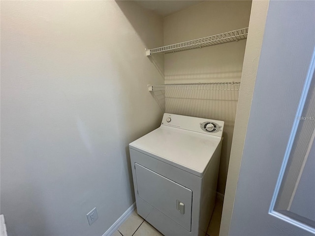 1020 Siena Park Blvd W Unit 304, Kissimmee, FL 34747 - laundry room with washer / clothes dryer and light tile patterned floors