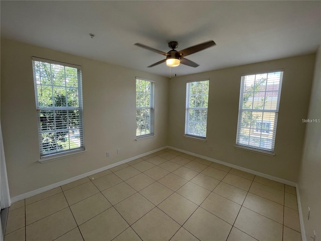 1020 Siena Park Blvd W Unit 304, Kissimmee, FL 34747 - empty room featuring light tile patterned floors, a ceiling fan, and baseboards