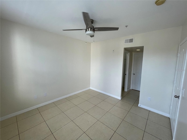 1020 Siena Park Blvd W Unit 304, Kissimmee, FL 34747 - empty room with ceiling fan, light tile patterned flooring, baseboards, fire sprinkler in ceiling, and a smoke detector