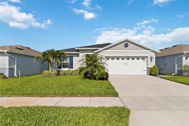 3211 Sweet Acres Pl, Saint Cloud, FL 34772 - single story home featuring a garage, board and batten siding, concrete driveway, and a front lawn