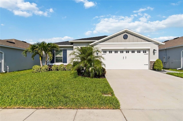 3211 Sweet Acres Pl, Saint Cloud, FL 34772 - single story home featuring concrete driveway, a garage, a front yard, board and batten siding, and stucco siding