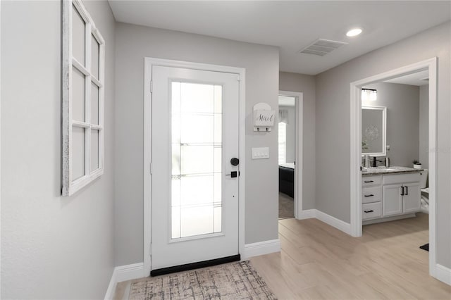 3211 Sweet Acres Pl, Saint Cloud, FL 34772 - foyer featuring light wood-type flooring and baseboards
