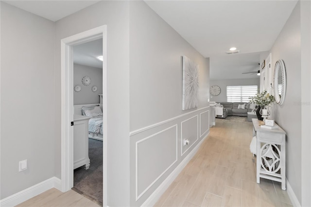3211 Sweet Acres Pl, Saint Cloud, FL 34772 - hall featuring light wood finished floors and baseboards
