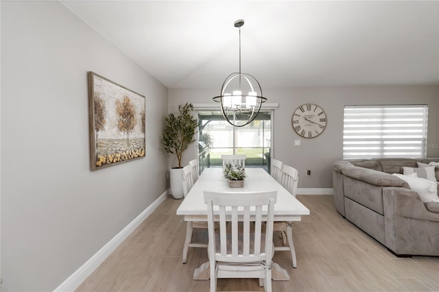 3211 Sweet Acres Pl, Saint Cloud, FL 34772 - dining room with baseboards, a chandelier, and light wood finished floors