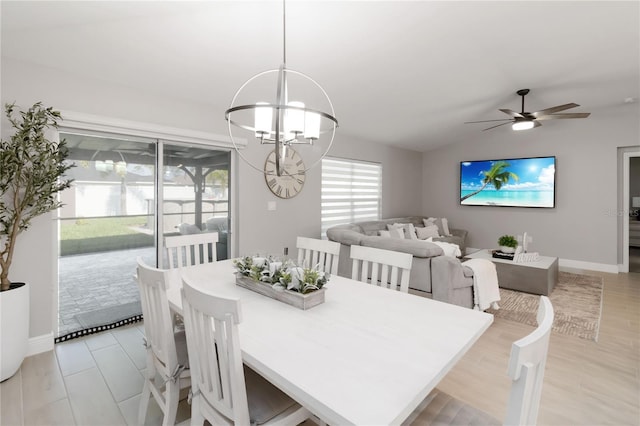 3211 Sweet Acres Pl, Saint Cloud, FL 34772 - dining space with a chandelier, lofted ceiling, ceiling fan, baseboards, and light wood-style flooring