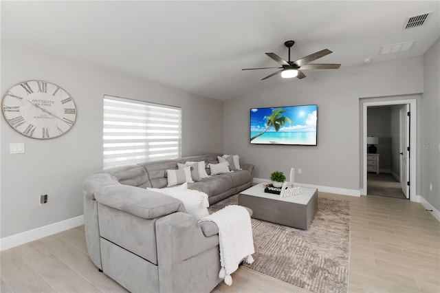 3211 Sweet Acres Pl, Saint Cloud, FL 34772 - living area featuring a ceiling fan, light wood finished floors, lofted ceiling, and baseboards