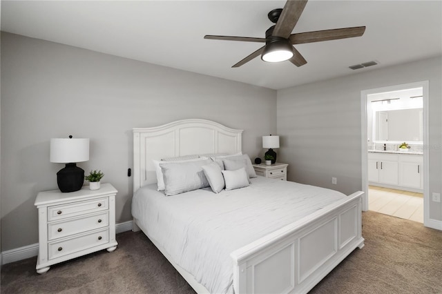 3211 Sweet Acres Pl, Saint Cloud, FL 34772 - bedroom with dark carpet, connected bathroom, and a ceiling fan