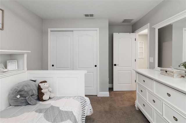 3211 Sweet Acres Pl, Saint Cloud, FL 34772 - bedroom featuring dark carpet, a closet, and baseboards