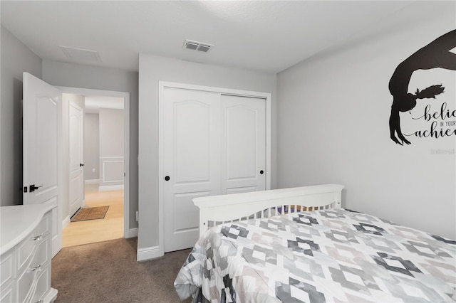 3211 Sweet Acres Pl, Saint Cloud, FL 34772 - bedroom featuring dark carpet, a closet, and baseboards