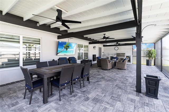 3211 Sweet Acres Pl, Saint Cloud, FL 34772 - view of patio with outdoor dining space, a ceiling fan, and exterior kitchen