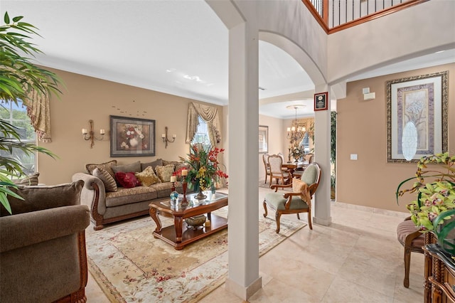 15037 Cedar Branch Way, Orlando, FL 32824 - living room featuring a chandelier, arched walkways, baseboards, and ornamental molding