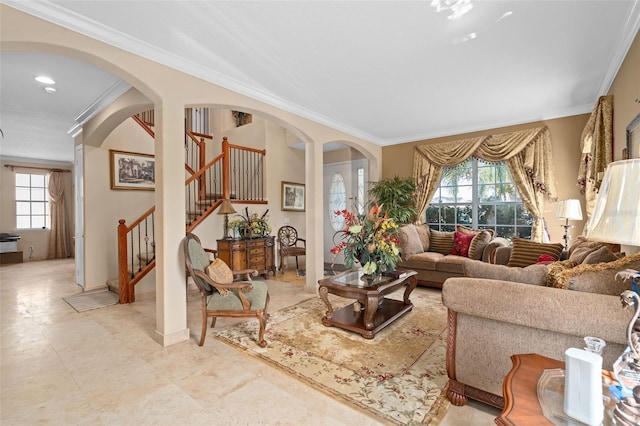 15037 Cedar Branch Way, Orlando, FL 32824 - living room featuring healthy amount of natural light, crown molding, stairway, arched walkways, and baseboards