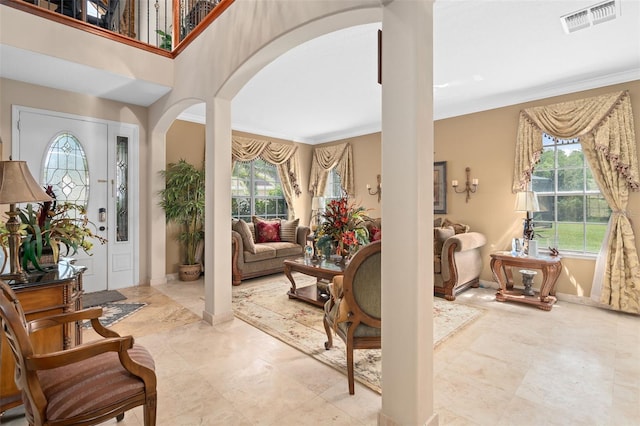 15037 Cedar Branch Way, Orlando, FL 32824 - entryway featuring arched walkways, ornamental molding, ornate columns, and baseboards