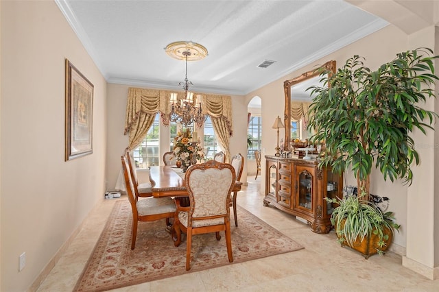 15037 Cedar Branch Way, Orlando, FL 32824 - dining area with ornamental molding, a chandelier, arched walkways, and baseboards