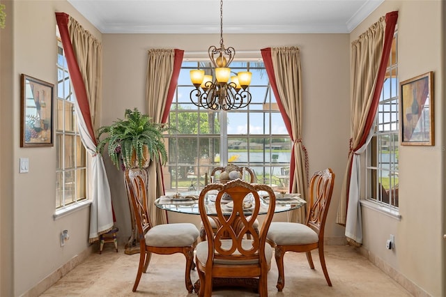 15037 Cedar Branch Way, Orlando, FL 32824 - dining space with a chandelier, ornamental molding, baseboards, and a water view