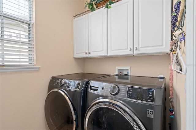 15037 Cedar Branch Way, Orlando, FL 32824 - washroom with independent washer and dryer and cabinet space