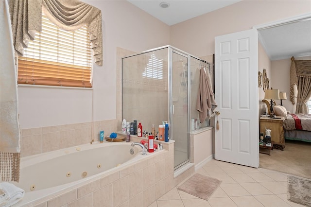 15037 Cedar Branch Way, Orlando, FL 32824 - bathroom featuring a whirlpool tub, a shower stall, tile patterned floors, and ensuite bath
