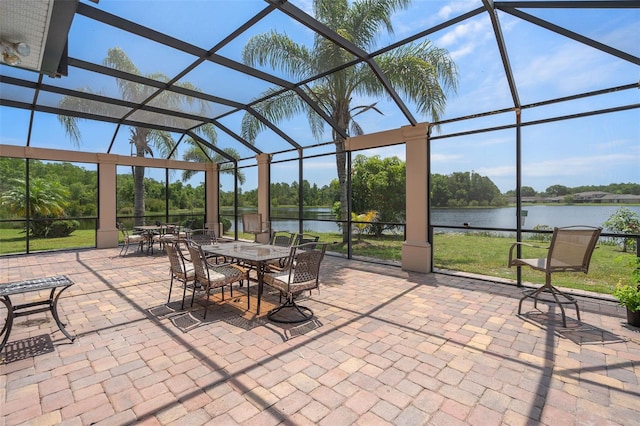 15037 Cedar Branch Way, Orlando, FL 32824 - view of patio / terrace featuring a water view, glass enclosure, view of scattered trees, and outdoor dining space
