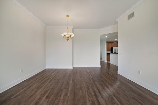 7468 Excitement Dr Unit 101, Reunion, FL 34747 - empty room with a chandelier, baseboards, ornamental molding, and dark wood-style floors