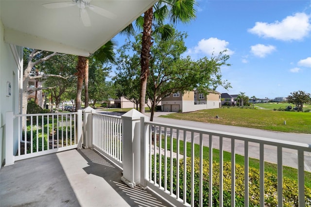 7468 Excitement Dr Unit 101, Reunion, FL 34747 - balcony featuring ceiling fan and a residential view