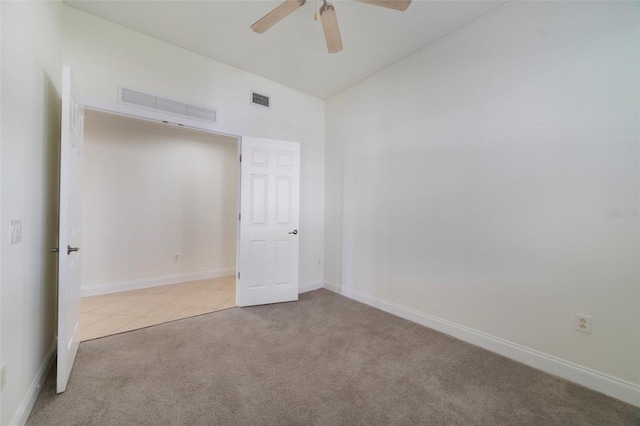 7468 Excitement Dr Unit 101, Reunion, FL 34747 - carpeted spare room with a ceiling fan, baseboards, and tile patterned floors