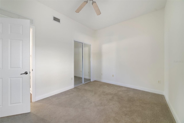 7468 Excitement Dr Unit 101, Reunion, FL 34747 - unfurnished bedroom featuring carpet flooring, a closet, baseboards, and ceiling fan