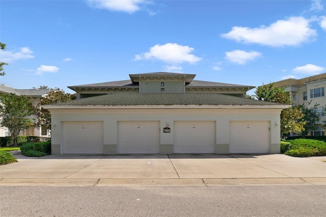 7468 Excitement Dr Unit 101, Reunion, FL 34747 - view of front of home with community garages and stucco siding