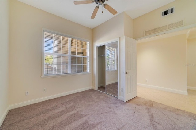 1501 Northern Harrier Way Unit 202, Reunion, FL 34747 - unfurnished bedroom with carpet, a closet, baseboards, and ceiling fan
