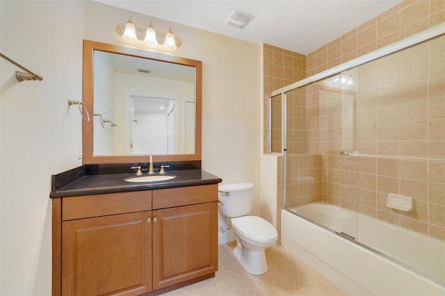 1501 Northern Harrier Way Unit 202, Reunion, FL 34747 - bathroom with toilet, vanity, bath / shower combo with glass door, and tile patterned flooring