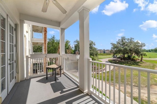 1501 Northern Harrier Way Unit 202, Reunion, FL 34747 - covered porch with golf course view and ceiling fan