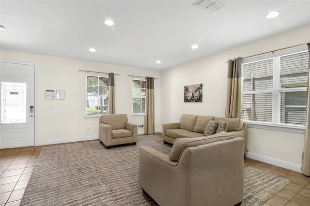 341 Lasso Dr, Kissimmee, FL 34747 - tiled living room featuring recessed lighting and baseboards