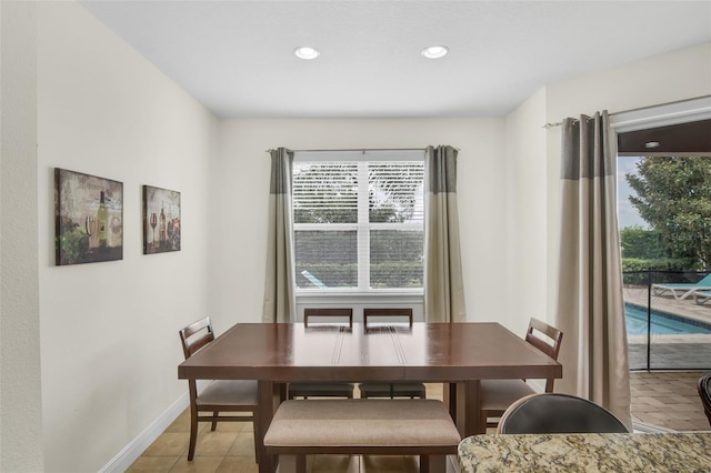 341 Lasso Dr, Kissimmee, FL 34747 - dining area with recessed lighting, light tile patterned floors, and baseboards