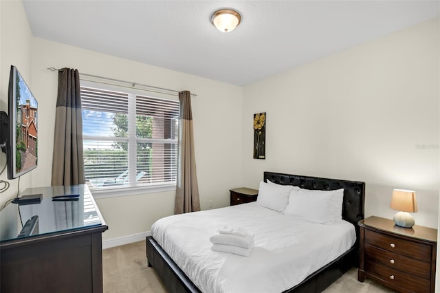 341 Lasso Dr, Kissimmee, FL 34747 - bedroom featuring light carpet and baseboards