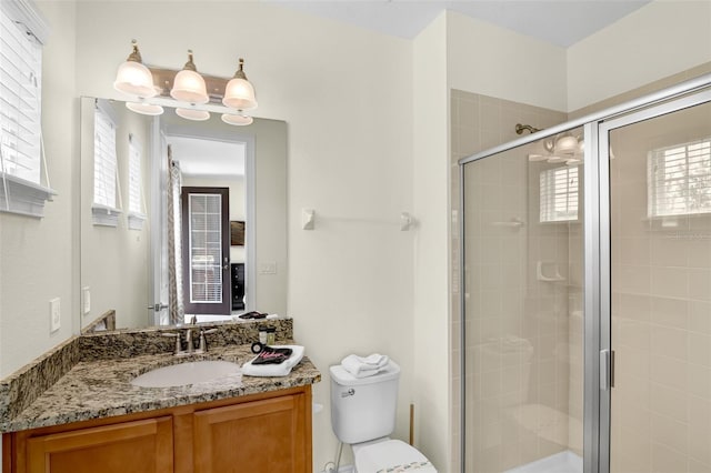 341 Lasso Dr, Kissimmee, FL 34747 - full bathroom featuring vanity, toilet, and a shower stall