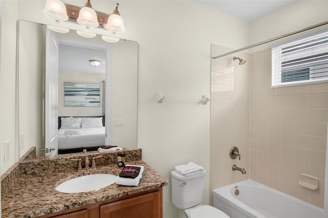 341 Lasso Dr, Kissimmee, FL 34747 - ensuite bathroom featuring vanity, washtub / shower combination, and toilet