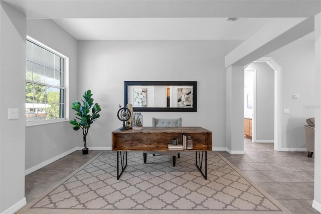 6479 Apple St, Saint Cloud, FL 34771 - office space featuring arched walkways, baseboards, and tile patterned flooring