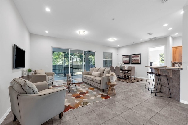 6479 Apple St, Saint Cloud, FL 34771 - living area with recessed lighting, light tile patterned floors, and baseboards